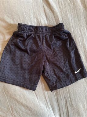 Nike Men's Black Athletic Mesh Shorts with White Swoosh